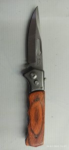 Нож складной кнопочный 2